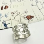 Family drawing cut out in sterling silver for a ring