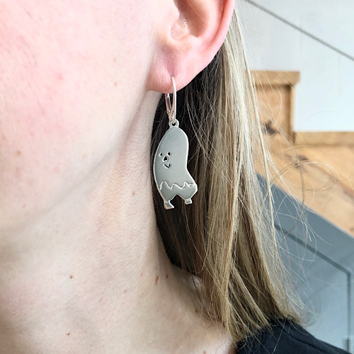 hanging ear piece in silver from artwork