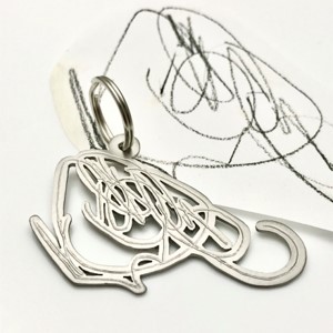 Titanium key chain after toddlers scribble drawing
