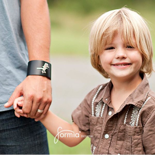wide leather cuff bracelet on dads arm with boys drawing