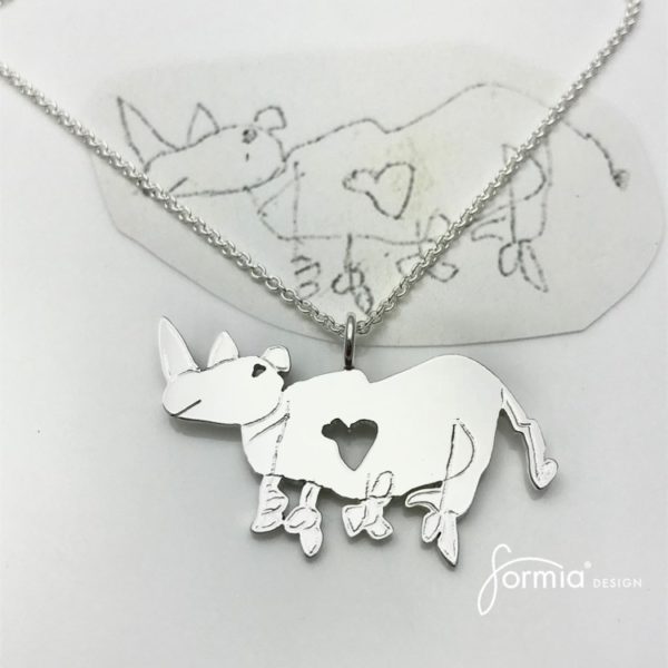 Kids drawing of animal rhino made into a silver artwork pendant