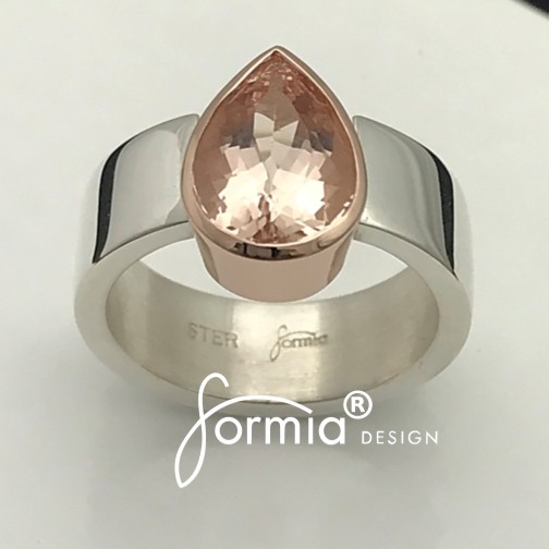 Pink morganite gemstone set in rose gold and silver band, possibly engagement ring to give to the favorite woman!