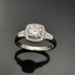 Round diamond in cusion shape halo engagement ring