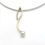 Combination pendants s shape and c shape designs in harmony, white pearl and bead set diamonds