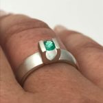 Emerald gemstone engagement ring in sterling silver