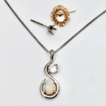 Orphaned earrings redesigned in to a necklace diamond and opal