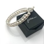 Leather strand with white pearls on bracelet