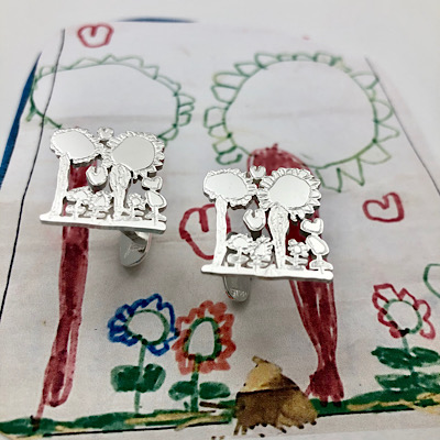 Little artists creates cufflinks as a gift for dad