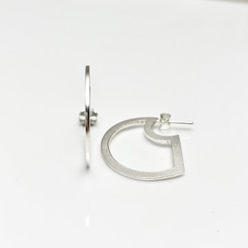 Hoop cutting edge silver earrings, flat inspired shape