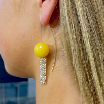 Yummy yellow bead for tassel earring on the ear