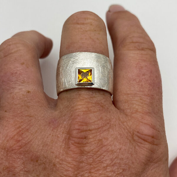 Wide frosty silver ring with bezel set square yellow topaz