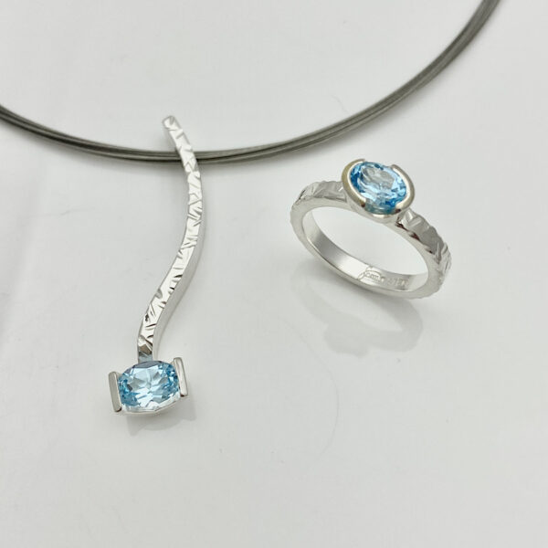 Light blue topaz pendant and stack ring in diamond metal texture for finish