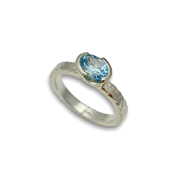 Oval angled sky topaz stack ring with textured shank design by Mia